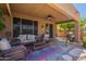 Inviting covered patio with cozy seating and a barbecue area at 102 W Raven Dr, Chandler, AZ 85286