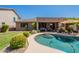 Inviting backyard pool features mature landscaping and sunny lounge areas at 102 W Raven Dr, Chandler, AZ 85286