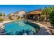 Backyard pool with patio furniture and mature landscaping at 102 W Raven Dr, Chandler, AZ 85286