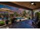 Inviting backyard pool with covered patio, perfect for outdoor entertaining and relaxation at 102 W Raven Dr, Chandler, AZ 85286