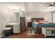 Bright bedroom features wood floors, ceiling fan, and ensuite vanity area at 10505 W Campana Dr, Sun City, AZ 85351