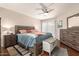Bedroom features wood floors, ceiling fan and natural light at 10505 W Campana Dr, Sun City, AZ 85351