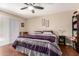 Bedroom features wood floors, ceiling fan and large windows at 10505 W Campana Dr, Sun City, AZ 85351