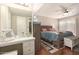 Bedroom features wood floors and sliding glass doors to backyard at 10505 W Campana Dr, Sun City, AZ 85351