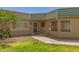 Inviting front entrance featuring a secure screen door and manicured lawn at 10505 W Campana Dr, Sun City, AZ 85351