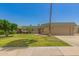 Charming single-story home with lush green lawn and attached two-car garage at 10505 W Campana Dr, Sun City, AZ 85351