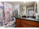 Bathroom with floral shower curtain and decorative accents at 11375 E Sahuaro Dr # 1062, Scottsdale, AZ 85259