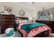 Spacious bedroom features a large bed, dresser, and decorative mirror at 11375 E Sahuaro Dr # 1062, Scottsdale, AZ 85259