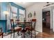 Cozy breakfast nook with dining table, chairs, and natural light from windows at 11375 E Sahuaro Dr # 1062, Scottsdale, AZ 85259