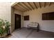Charming front porch with seating, creating a welcoming entrance to the home at 11375 E Sahuaro Dr # 1062, Scottsdale, AZ 85259