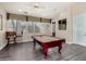 Bright game room with a pool table and seating area at 11375 E Sahuaro Dr # 1062, Scottsdale, AZ 85259