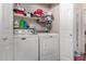 Laundry room with washer, dryer, and shelving for storage at 11375 E Sahuaro Dr # 1062, Scottsdale, AZ 85259