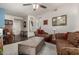 Spacious living room with stylish furniture, ceiling fan, and hardwood floors at 11375 E Sahuaro Dr # 1062, Scottsdale, AZ 85259