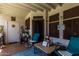 Cozy covered patio with seating and decorative plants at 11375 E Sahuaro Dr # 1062, Scottsdale, AZ 85259