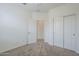 Spacious, empty bedroom with plush carpet, neutral walls, and double door closet at 11470 E Yeager Cyn, Gold Canyon, AZ 85118