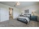 Cozy bedroom with carpet flooring, ceiling fan, and a view of the ensuite bathroom at 11470 E Yeager Cyn, Gold Canyon, AZ 85118