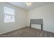 An empty bedroom featuring a headboard, plush carpet, and neutral walls at 11470 E Yeager Cyn, Gold Canyon, AZ 85118