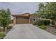 Charming single-story home with a well-maintained front yard and a two-car garage at 11470 E Yeager Cyn, Gold Canyon, AZ 85118
