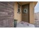 Inviting front entrance with a decorative wreath, welcome mat, and a stone accent wall at 11470 E Yeager Cyn, Gold Canyon, AZ 85118