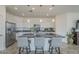 Spacious kitchen features a large island, stainless steel appliances, and modern lighting fixtures at 11470 E Yeager Cyn, Gold Canyon, AZ 85118