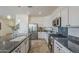 Well-equipped kitchen with stainless steel appliances, granite countertops, and ample cabinet space at 11470 E Yeager Cyn, Gold Canyon, AZ 85118