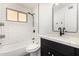 Updated bathroom featuring a bathtub and modern vanity at 12453 N 29Th Ave, Phoenix, AZ 85029