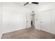 Bright bedroom featuring a ceiling fan and closet space for ample storage at 12453 N 29Th Ave, Phoenix, AZ 85029