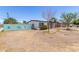 Single-story home featuring a bright yellow front door and desert landscape at 12453 N 29Th Ave, Phoenix, AZ 85029