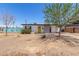 Single-story home featuring a yellow front door and a low maintenance desert landscape at 12453 N 29Th Ave, Phoenix, AZ 85029