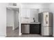 Modern kitchen with stainless steel appliances and sleek black and white cabinetry at 12453 N 29Th Ave, Phoenix, AZ 85029