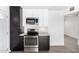 Updated kitchen with stainless steel appliances and white subway tile backsplash at 12453 N 29Th Ave, Phoenix, AZ 85029