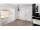 Eat in kitchen features bright white paint, modern pendant lighting and sleek cabinetry at 12453 N 29Th Ave, Phoenix, AZ 85029