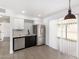 Bright kitchen boasts stainless steel appliances, white backsplash, and modern finishes at 12453 N 29Th Ave, Phoenix, AZ 85029