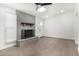 Light filled living room with stylish gray brick fireplace and skylight at 12453 N 29Th Ave, Phoenix, AZ 85029