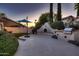 Outdoor living space featuring BBQ grill and built in fire pit at 12754 E Laurel Ln, Scottsdale, AZ 85259