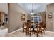 Dining room featuring wood table, chairs, and natural light at 12754 E Laurel Ln, Scottsdale, AZ 85259