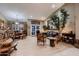 Open-concept living and dining area with modern furnishings, neutral colors, and ample natural light at 12754 E Laurel Ln, Scottsdale, AZ 85259