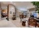 Open-concept living and dining area with modern furnishings, neutral colors, and ample natural light at 12754 E Laurel Ln, Scottsdale, AZ 85259