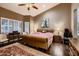 Comfortable main bedroom with a large bed, plantation shutters, and stylish decor at 12754 E Laurel Ln, Scottsdale, AZ 85259