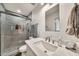 Modern bathroom featuring a walk-in shower with gray tile and glass door at 12826 N 29Th St, Phoenix, AZ 85032