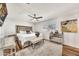 Bright bedroom with a plush rug, mirrored dresser, and natural light from a window at 12826 N 29Th St, Phoenix, AZ 85032