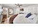 Well-lit bedroom showcasing a full-length mirror and access to an ensuite bathroom at 12826 N 29Th St, Phoenix, AZ 85032