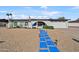 Charming single-story home featuring unique blue walkway, arched entry, and desert landscaping at 12826 N 29Th St, Phoenix, AZ 85032