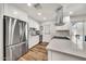 Bright kitchen featuring stainless steel appliances, white cabinets, and modern countertops at 12826 N 29Th St, Phoenix, AZ 85032