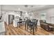 Modern kitchen with white cabinets, stainless steel appliances, and an island with seating at 12826 N 29Th St, Phoenix, AZ 85032