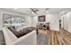 Inviting living room with wood flooring, a comfortable couch, and modern decor at 12826 N 29Th St, Phoenix, AZ 85032