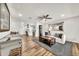 Stylish living room with wood floors and an open view into the modern kitchen at 12826 N 29Th St, Phoenix, AZ 85032