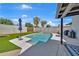 Sparkling pool with spacious concrete decking and low-maintenance artificial grass at 12826 N 29Th St, Phoenix, AZ 85032