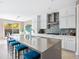 Spacious kitchen with a large island, stainless steel appliances, and white cabinetry at 13406 W Rowel Rd, Peoria, AZ 85383