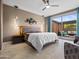 Comfortable main bedroom features a sliding door leading to an outdoor seating area at 13406 W Rowel Rd, Peoria, AZ 85383